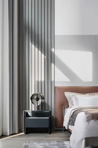 Contemporary bedroom featuring a textured wall and minimalist design elements.