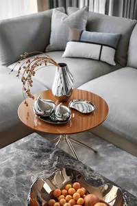 Modern, metallic pieces in a living room setting.