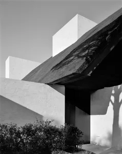 Modern minimalist house featuring concrete exterior.