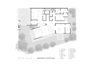 A detailed architectural blueprint of the ground floor layout of a residential building, showing rooms, windows, and doors.