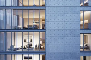 Modern office space with concrete walls and large windows.