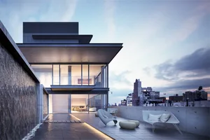 Modem residential building with glass walls, concrete surfaces, and a waterfall feature