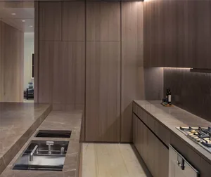 Modern kitchen featuring marble countertops and backsplash