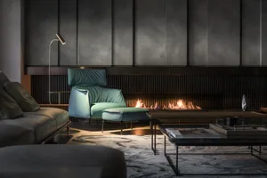 Modern living room with concrete, leather, and metal furniture, warm lighting, and a warm fireplace.