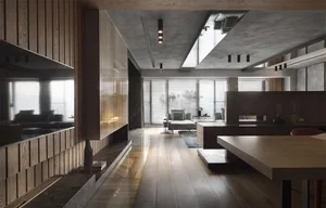 Modern minimalist living room with wooden flooring, glass walls, and a concrete ceiling.