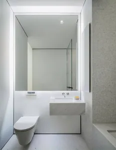 White marble bathroom with modern fixtures and minimalist design