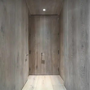 Modern wood entryway with minimalist flooring.