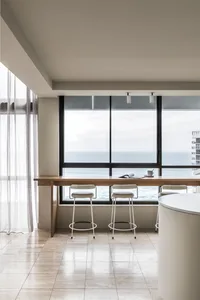 A modern interior design featuring wood, glass, and metal materials.