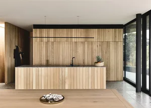 A modern minimalist kitchen featuring wooden elements and a sleek, contemporary design.