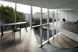 Modern residential interior adorned with wood, glass, and metal elements.
