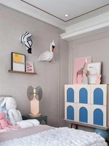 A modern children's bedroom with textured paneling and wooden furniture.