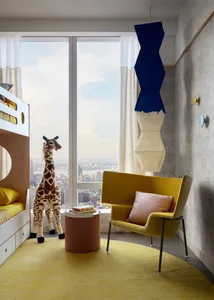 Modern children's room with yellow floor, bunk bed, stuffed giraffe, and hanging light fixture in a cityscape backdrop.