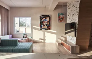 A modern, industrial-style living room with contemporary furniture and decorative elements.