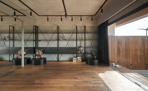 Metal shelving units with various objects on display in an industrial setting.