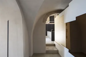 Modern minimalist interior space with concrete walls and floor.