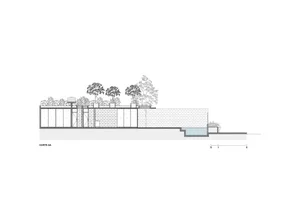 A modern exterior design featuring brick, concrete, and glass elements.