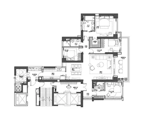 A detailed floor plan of a residential living space with multiple bedrooms, a kitchen, and various other amenities.