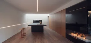 Modern kitchen with an empty space, featuring wooden flooring and minimalist design.