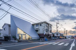 Modern residential architecture in a neighborhood setting with minimalist design features.