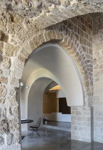 A modern interior space featuring stone and concrete materials.