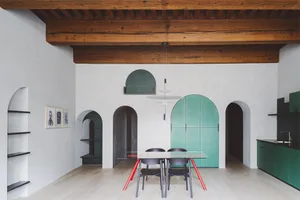 A modern interior design featuring a wooden ceiling with concrete walls and flooring.