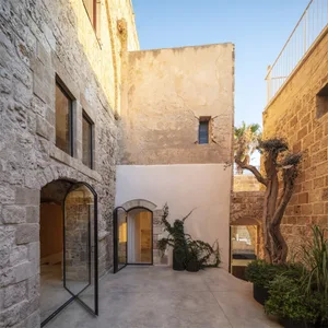 A modern stone house with a doorway