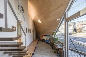 Modern industrial interior space featuring raw wood materials and minimalist design.