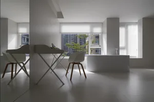Modern minimalist living room with a white laminate finish.