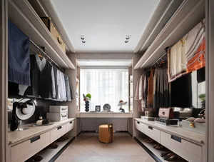 A modern closet with wooden cabinets, showcasing streamlined design and functional storage solutions.
