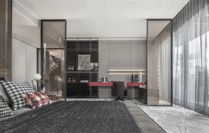 Modern industrial bedroom with a minimalist design, featuring a dark grey bed frame, clear glass dividers, and a sleek desk.