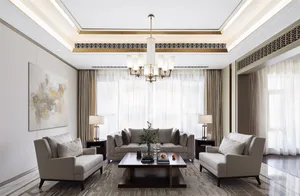 A modern living room with neutral-toned fabric furniture, light wood accents, and large windows with white curtains.
