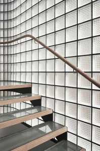 Modern staircase designed with glass blocks and lighting fixtures.