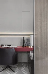 A modern home office featuring a sleek metallic red desk in a minimalist design setting.
