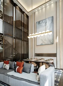 Modern interior design featuring contemporary furniture and lighting in a living and dining room.