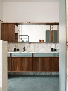 Modern interior design featuring marble cabinets and wooden accents.