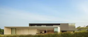 Modern house exterior with extensive use of glass.