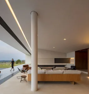 Modern minimalist living space featuring concrete and wooden elements