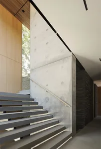 Modern interior with concrete stairs and minimalist design.