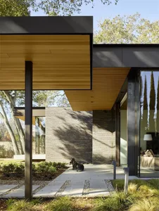 A modern entryway featuring wood and concrete materials.