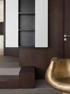 Modern entryway featuring wooden walls and metal accents.