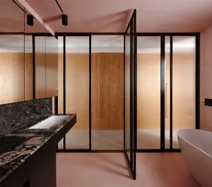 Modern bathroom with glass shower doors and wooden accents