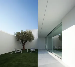A minimalist modern residential exterior showcases clean lines and a muted color palette, featuring concrete materials and a 