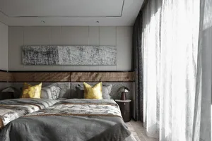 Modern bedroom interior with mixed materials, showcasing contemporary design elements and sophisticated color palette.