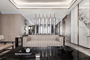 Modern living room featuring a sleek, light-colored leather couch against a minimalist backdrop.