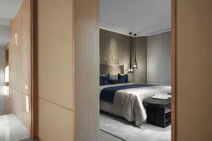Modern minimalist bedroom featuring wood, fabric, and glass elements