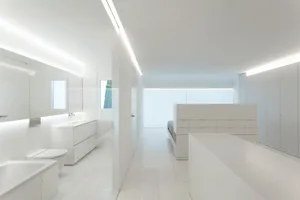 A modern minimalist bathroom with white tiles and construction.
