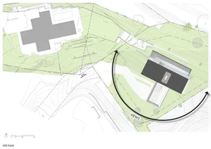 A detailed architectural site plan showing a modern building and surrounding landscape.
