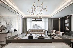 Modern living room featuring a marble floor, a contemporary sofa, and a glass table.