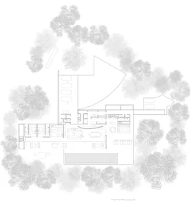 Concrete modern residential floor plan with open layout and large windows surrounded by trees.