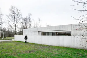 A modern house extension constructed with concrete materials.